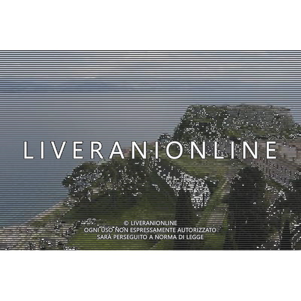 (140308) -- CORFU, Mar. 8, 2014 () -- Photo taken on March 8, 2014 shows a scenery of the old town of Corfu, Greece. The Old Town of Corfu, on the Greek Island of Corfu off the western coasts of Albania and Greece, is located in a strategic position at the entrance of the Adriatic Sea, and has its roots in the 8th century BC. The three forts of the town, designed by renowned Venetian engineers, were used from 1386 to 1797 by Venice to defend the maritime trading interests of the Republic of Venice against the Ottoman Empire. In the course of time, the forts were repaired and partly rebuilt several times, more recently under British rule in the 19th century. The mainly neoclassical housing stock of the Old Town is partly from the Venetian period, partly of later construction, notably the 19th century. As a fortified Mediterranean port, Corfu\' s urban and port ensemble is notable for its high level of integrity and authenticity. The ensemble was inscribed as UNESCO World Heritage Site in 2007. It is the most recent inscribed among the 17 UNESCO World Heritage Sites in Greece. (/Liu Yongqiu) ©photoshot/AGENZIA ALDO LIVERANI SAS - ITALY ONLY - Vedute della citta\' vecchia di Corfu al largo delle coste occidentali di Albania e Grecia, si trova dentro una posizione strategica all\'ingresso del Mare Adriatico, iscritta come patrimonio mondiale dell\'UNESCO nel 2007