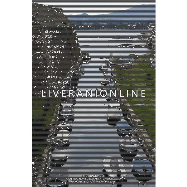 (140308) -- CORFU, Mar. 8, 2014 () -- Photo taken on March 8, 2014 shows a scenery of the old town of Corfu, Greece. The Old Town of Corfu, on the Greek Island of Corfu off the western coasts of Albania and Greece, is located in a strategic position at the entrance of the Adriatic Sea, and has its roots in the 8th century BC. The three forts of the town, designed by renowned Venetian engineers, were used from 1386 to 1797 by Venice to defend the maritime trading interests of the Republic of Venice against the Ottoman Empire. In the course of time, the forts were repaired and partly rebuilt several times, more recently under British rule in the 19th century. The mainly neoclassical housing stock of the Old Town is partly from the Venetian period, partly of later construction, notably the 19th century. As a fortified Mediterranean port, Corfu\' s urban and port ensemble is notable for its high level of integrity and authenticity. The ensemble was inscribed as UNESCO World Heritage Site in 2007. It is the most recent inscribed among the 17 UNESCO World Heritage Sites in Greece. (/Liu Yongqiu) ©photoshot/AGENZIA ALDO LIVERANI SAS - ITALY ONLY - Vedute della citta\' vecchia di Corfu al largo delle coste occidentali di Albania e Grecia, si trova dentro una posizione strategica all\'ingresso del Mare Adriatico, iscritta come patrimonio mondiale dell\'UNESCO nel 2007