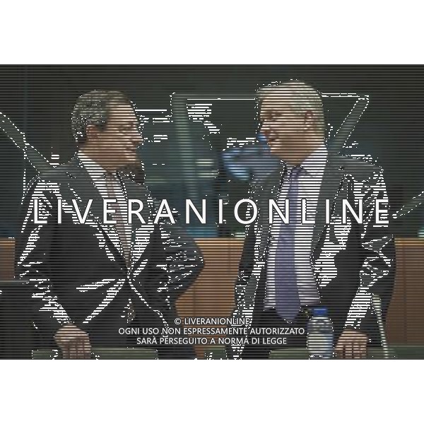 President of the European Central Bank (ECB) Mario Draghi and Olli Rehn, the European Commissioner in charge of the Monetary Affairs (R ) prior to the Eurogroup Finance Ministers meeting at the EU council headquarters in Brussels, Belgium on 10.03.2014 The Eurogroup is to discuss Winter 2014 European economic forecast by the European Commission, European Stability Mechanism (ESM) direct bank recapitalization instrument and economic adjustment programme in Cyprus, Greece and Portugal. by Wiktor Dabkowski AG ALDO LIVERANI SAS ONLY ITALY