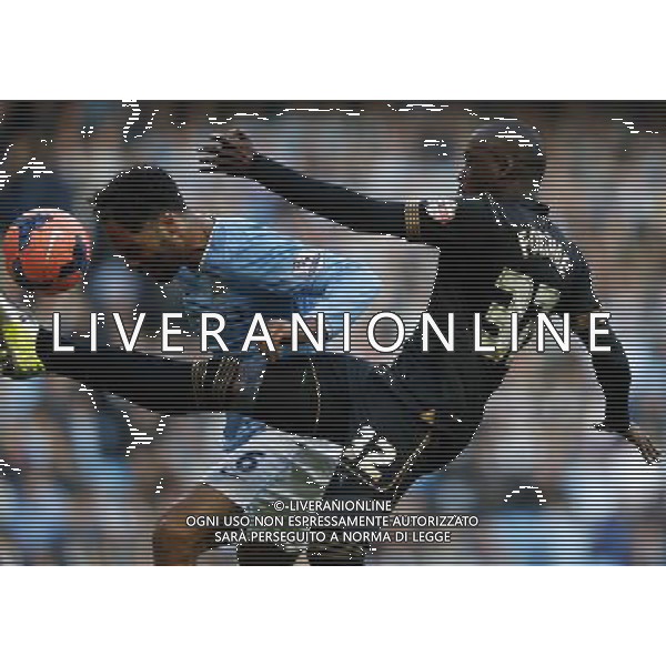 (140310) -- MANCHESTER, March 10, 2014 () -- Joleon Lescott (L) of Manchester City vies with Marc-Antoine Fortune of Wigan during FA Cup quarterfinal match at Etihad Stadium in Manchester, Britain on March 9, 2014. Manchester City lost 1-2. (/Wang Lili) FOR EDITORIAL USE ONLY. NOT FOR SALE FOR MARKETING OR ADVERTISING CAMPAIGNS. NO USE WITH UNAUTHORIZED AUDIO, VIDEO, DATA, FIXTURE LISTS, CLUBLEAGUE LOGOS OR LIVE SERVICES. ONLINE IN-MATCH USE LIMITED TO 45 IMAGES, NO VIDEO EMULATION. NO USE IN BETTING, GAMES OR SINGLE CLUBLEAGUEPLAYER PUBLICATIONS. AG ALDO LIVERANI SAS ONLY ITALY