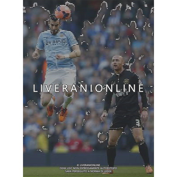 (140310) -- MANCHESTER, March 10, 2014 () -- Alvaro Negredo (L) of Manchester City heads the ball as Stephen Crainey of Wigan looks on during FA Cup quarterfinal match between Manchester City and Wigan at Etihad Stadium in Manchester, Britain on March 9, 2014. Manchester City lost 1-2. (/Wang Lili) FOR EDITORIAL USE ONLY. NOT FOR SALE FOR MARKETING OR ADVERTISING CAMPAIGNS. NO USE WITH UNAUTHORIZED AUDIO, VIDEO, DATA, FIXTURE LISTS, CLUBLEAGUE LOGOS OR LIVE SERVICES. ONLINE IN-MATCH USE LIMITED TO 45 IMAGES, NO VIDEO EMULATION. NO USE IN BETTING, GAMES OR SINGLE CLUBLEAGUEPLAYER PUBLICATIONS. AG ALDO LIVERANI SAS ONLY ITALY