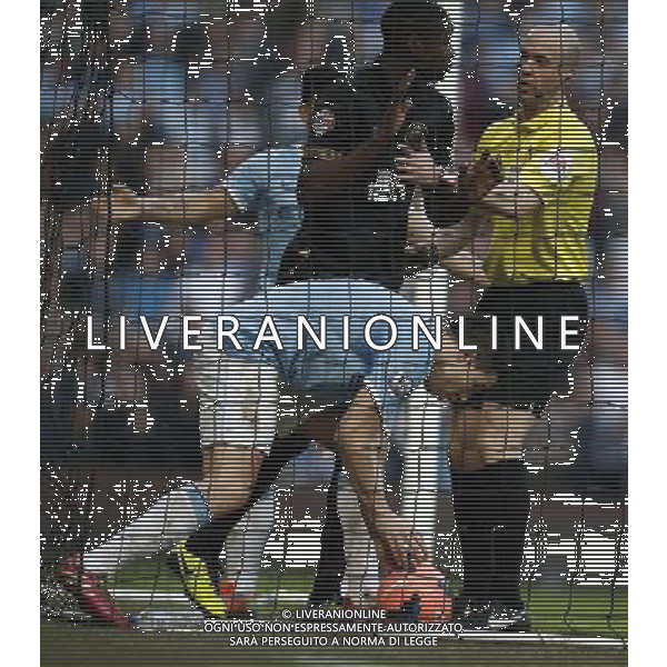 (140310) -- MANCHESTER, March 10, 2014 () -- Samir Nasri (bottom) of Manchester City picks up the ball after scoring the team\'s only goal during FA Cup quarterfinal match between Manchester City and Wigan at Etihad Stadium in Manchester, Britain on March 9, 2014. Manchester City lost 1-2. (/Wang Lili) FOR EDITORIAL USE ONLY. NOT FOR SALE FOR MARKETING OR ADVERTISING CAMPAIGNS. NO USE WITH UNAUTHORIZED AUDIO, VIDEO, DATA, FIXTURE LISTS, CLUBLEAGUE LOGOS OR LIVE SERVICES. ONLINE IN-MATCH USE LIMITED TO 45 IMAGES, NO VIDEO EMULATION. NO USE IN BETTING, GAMES OR SINGLE CLUBLEAGUEPLAYER PUBLICATIONS. AG ALDO LIVERANI SAS ONLY ITALY