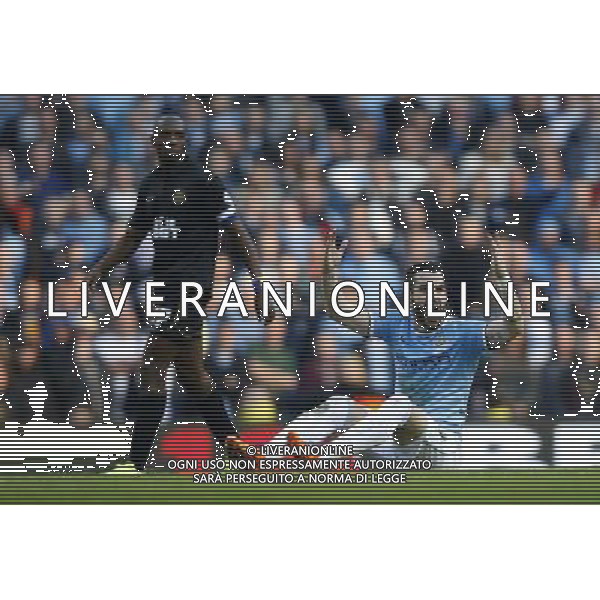 (140310) -- MANCHESTER, March 10, 2014 () -- Alvaro Negredo (R) of Manchester City reacts during FA Cup quarterfinal match between Manchester City and Wigan at Etihad Stadium in Manchester, Britain on March 9, 2014. Manchester City lost 1-2. (/Wang Lili) FOR EDITORIAL USE ONLY. NOT FOR SALE FOR MARKETING OR ADVERTISING CAMPAIGNS. NO USE WITH UNAUTHORIZED AUDIO, VIDEO, DATA, FIXTURE LISTS, CLUBLEAGUE LOGOS OR LIVE SERVICES. ONLINE IN-MATCH USE LIMITED TO 45 IMAGES, NO VIDEO EMULATION. NO USE IN BETTING, GAMES OR SINGLE CLUBLEAGUEPLAYER PUBLICATIONS. AG ALDO LIVERANI SAS ONLY ITALY