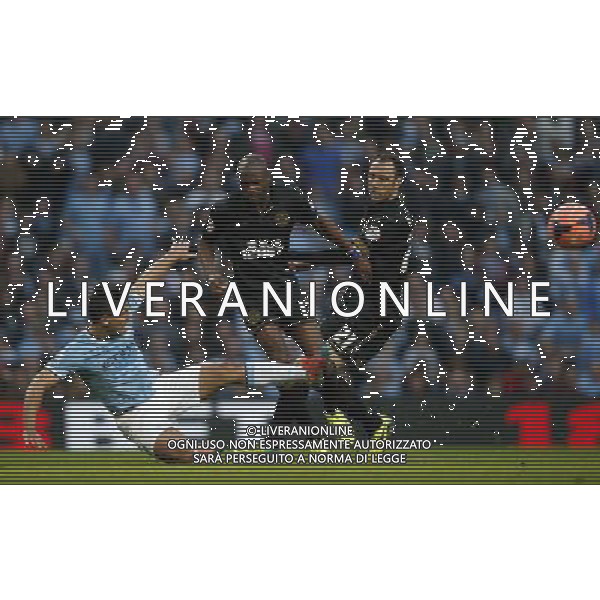 (140310) -- MANCHESTER, March 10, 2014 () -- Sergio Aguero (L) of Manchester City vies with Emmerson Boyce of Wigan during FA Cup quarterfinal match at Etihad Stadium in Manchester, Britain on March 9, 2014. Manchester City lost 1-2. (/Wang Lili) FOR EDITORIAL USE ONLY. NOT FOR SALE FOR MARKETING OR ADVERTISING CAMPAIGNS. NO USE WITH UNAUTHORIZED AUDIO, VIDEO, DATA, FIXTURE LISTS, CLUBLEAGUE LOGOS OR LIVE SERVICES. ONLINE IN-MATCH USE LIMITED TO 45 IMAGES, NO VIDEO EMULATION. NO USE IN BETTING, GAMES OR SINGLE CLUBLEAGUEPLAYER PUBLICATIONS. AG ALDO LIVERANI SAS ONLY ITALY