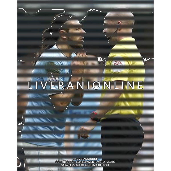 (140310) -- MANCHESTER, March 10, 2014 () -- Martin Demichelis (L) of Manchester City pleads to referee Anthony Taylor during FA Cup quarterfinal match between Manchester City and Wigan at Etihad Stadium in Manchester, Britain on March 9, 2014. Manchester City lost 1-2. (/Wang Lili) FOR EDITORIAL USE ONLY. NOT FOR SALE FOR MARKETING OR ADVERTISING CAMPAIGNS. NO USE WITH UNAUTHORIZED AUDIO, VIDEO, DATA, FIXTURE LISTS, CLUBLEAGUE LOGOS OR LIVE SERVICES. ONLINE IN-MATCH USE LIMITED TO 45 IMAGES, NO VIDEO EMULATION. NO USE IN BETTING, GAMES OR SINGLE CLUBLEAGUEPLAYER PUBLICATIONS. AG ALDO LIVERANI SAS ONLY ITALY