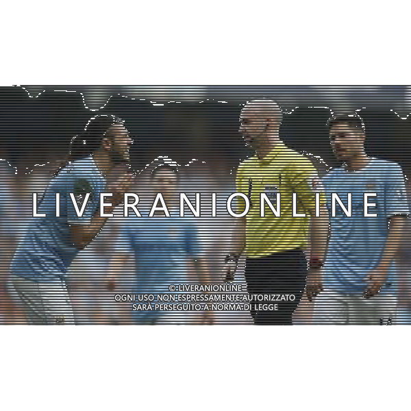 (140310) -- MANCHESTER, March 10, 2014 () -- Martin Demichelis (L) of Manchester City pleads to referee Anthony Taylor during FA Cup quarterfinal match between Manchester City and Wigan at Etihad Stadium in Manchester, Britain on March 9, 2014. Manchester City lost 1-2. (/Wang Lili) FOR EDITORIAL USE ONLY. NOT FOR SALE FOR MARKETING OR ADVERTISING CAMPAIGNS. NO USE WITH UNAUTHORIZED AUDIO, VIDEO, DATA, FIXTURE LISTS, CLUBLEAGUE LOGOS OR LIVE SERVICES. ONLINE IN-MATCH USE LIMITED TO 45 IMAGES, NO VIDEO EMULATION. NO USE IN BETTING, GAMES OR SINGLE CLUBLEAGUEPLAYER PUBLICATIONS. AG ALDO LIVERANI SAS ONLY ITALY