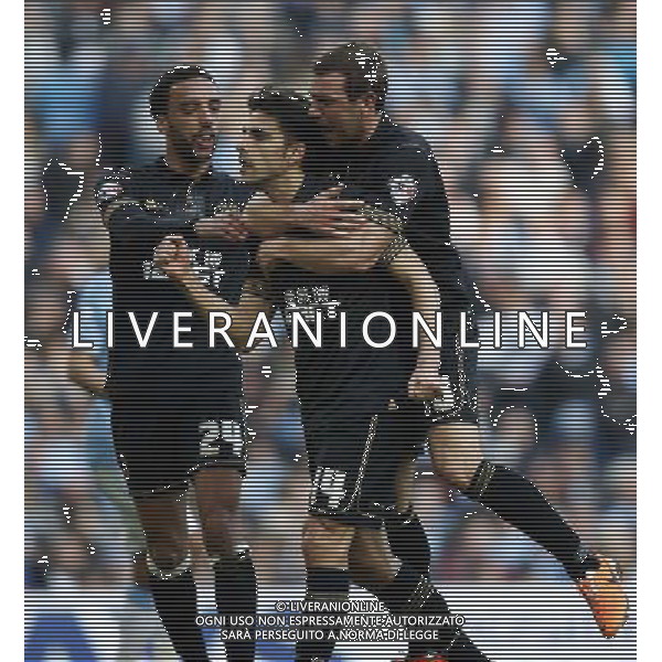 (140310) -- MANCHESTER, March 10, 2014 () -- Jordi Gomez (C) of Wigan celebrates scoring their team\'s first goal from the penalty spot with teammates after FA Cup quarterfinal match between Manchester City and Wigan at Etihad Stadium in Manchester, Britain on March 9, 2014. Wigan won 2-1. (/Wang Lili) FOR EDITORIAL USE ONLY. NOT FOR SALE FOR MARKETING OR ADVERTISING CAMPAIGNS. NO USE WITH UNAUTHORIZED AUDIO, VIDEO, DATA, FIXTURE LISTS, CLUBLEAGUE LOGOS OR LIVE SERVICES. ONLINE IN-MATCH USE LIMITED TO 45 IMAGES, NO VIDEO EMULATION. NO USE IN BETTING, GAMES OR SINGLE CLUBLEAGUEPLAYER PUBLICATIONS. AG ALDO LIVERANI SAS ONLY ITALY