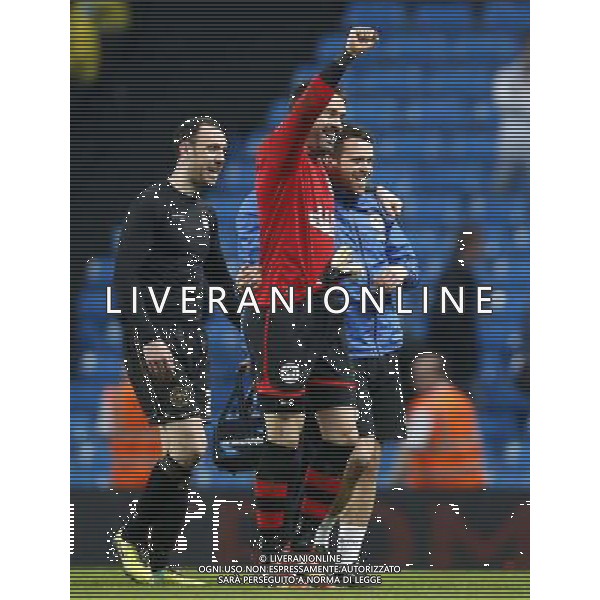 (140310) -- MANCHESTER, March 10, 2014 () -- Scott Carson (C), goalie of Wigan celebrates victory with teammates after FA Cup quarterfinal match between Manchester City and Wigan at Etihad Stadium in Manchester, Britain on March 9, 2014. Wigan won 2-1. (/Wang Lili) FOR EDITORIAL USE ONLY. NOT FOR SALE FOR MARKETING OR ADVERTISING CAMPAIGNS. NO USE WITH UNAUTHORIZED AUDIO, VIDEO, DATA, FIXTURE LISTS, CLUBLEAGUE LOGOS OR LIVE SERVICES. ONLINE IN-MATCH USE LIMITED TO 45 IMAGES, NO VIDEO EMULATION. NO USE IN BETTING, GAMES OR SINGLE CLUBLEAGUEPLAYER PUBLICATIONS. AG ALDO LIVERANI SAS ONLY ITALY