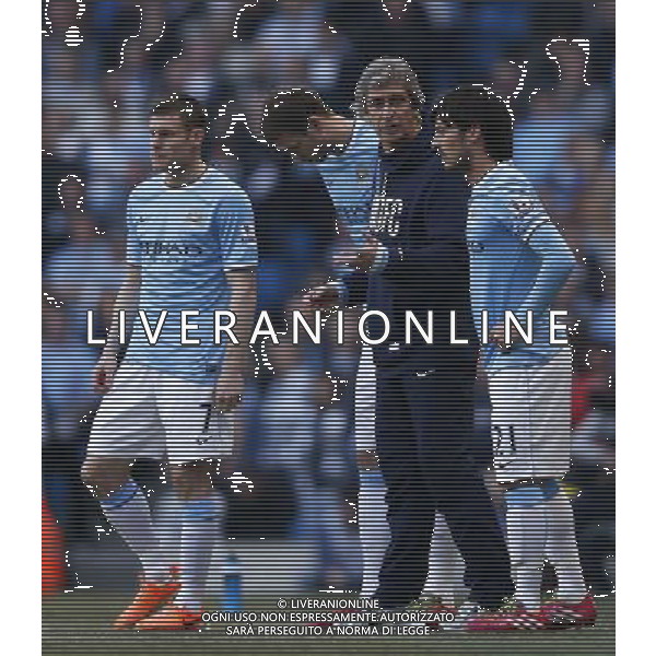 (140310) -- MANCHESTER, March 10, 2014 () -- Manuel Pellegrini (2nd, R), manager of Manchester City gives instructions to David Silva (1st, R), James Milner(1st, L) and Edin Dzeko after they are summoned from the bench to make a triple substitution during FA Cup quarterfinal match between Manchester City and Wigan at Etihad Stadium in Manchester, Britain on March 9, 2014. Manchester City lost 1-2. (/Wang Lili) FOR EDITORIAL USE ONLY. NOT FOR SALE FOR MARKETING OR ADVERTISING CAMPAIGNS. NO USE WITH UNAUTHORIZED AUDIO, VIDEO, DATA, FIXTURE LISTS, CLUBLEAGUE LOGOS OR LIVE SERVICES. ONLINE IN-MATCH USE LIMITED TO 45 IMAGES, NO VIDEO EMULATION. NO USE IN BETTING, GAMES OR SINGLE CLUBLEAGUEPLAYER PUBLICATIONS. AG ALDO LIVERANI SAS ONLY ITALY