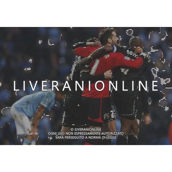 (140310) -- MANCHESTER, March 10, 2014 () -- Scott Carson (R2), goalie of Wigan celebrates victory with teammates after FA Cup quarterfinal match between Manchester City and Wigan at Etihad Stadium in Manchester, Britain on March 9, 2014. Wigan won 2-1. (/Wang Lili) FOR EDITORIAL USE ONLY. NOT FOR SALE FOR MARKETING OR ADVERTISING CAMPAIGNS. NO USE WITH UNAUTHORIZED AUDIO, VIDEO, DATA, FIXTURE LISTS, CLUBLEAGUE LOGOS OR LIVE SERVICES. ONLINE IN-MATCH USE LIMITED TO 45 IMAGES, NO VIDEO EMULATION. NO USE IN BETTING, GAMES OR SINGLE CLUBLEAGUEPLAYER PUBLICATIONS. AG ALDO LIVERANI SAS ONLY ITALY