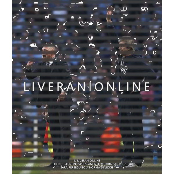 (140310) -- MANCHESTER, March 10, 2014 () -- Uwe Rosler (L), manager of Wigan gives instructions as Manuel Pellegrini, manager of Manchester City gestures during FA Cup quarterfinal match between Manchester City and Wigan at Etihad Stadium in Manchester, Britain on March 9, 2014. Wigan won 2-1. (/Wang Lili) FOR EDITORIAL USE ONLY. NOT FOR SALE FOR MARKETING OR ADVERTISING CAMPAIGNS. NO USE WITH UNAUTHORIZED AUDIO, VIDEO, DATA, FIXTURE LISTS, CLUBLEAGUE LOGOS OR LIVE SERVICES. ONLINE IN-MATCH USE LIMITED TO 45 IMAGES, NO VIDEO EMULATION. NO USE IN BETTING, GAMES OR SINGLE CLUBLEAGUEPLAYER PUBLICATIONS. AG ALDO LIVERANI SAS ONLY ITALY