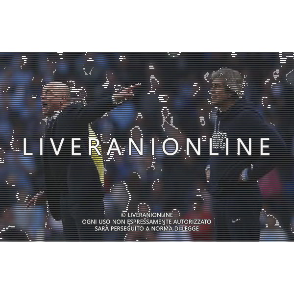 (140310) -- MANCHESTER, March 10, 2014 () -- Uwe Rosler (L), manager of Wigan gives instructions as Manuel Pellegrini, manager of Manchester City looks on during FA Cup quarterfinal match between Manchester City and Wigan at Etihad Stadium in Manchester, Britain on March 9, 2014. Wigan won 2-1. (/Wang Lili) FOR EDITORIAL USE ONLY. NOT FOR SALE FOR MARKETING OR ADVERTISING CAMPAIGNS. NO USE WITH UNAUTHORIZED AUDIO, VIDEO, DATA, FIXTURE LISTS, CLUBLEAGUE LOGOS OR LIVE SERVICES. ONLINE IN-MATCH USE LIMITED TO 45 IMAGES, NO VIDEO EMULATION. NO USE IN BETTING, GAMES OR SINGLE CLUBLEAGUEPLAYER PUBLICATIONS. AG ALDO LIVERANI SAS ONLY ITALY