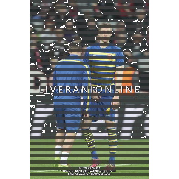 l-r: Lukas PODOLSKI #9 (FC Arsenal London), Per MERTESACKER #4 (FC Arsenal London) beim warm up during the UEFA Champions League Round of 16, 2nd Leg match between FC Bayern Munich and Arsenal FC at the Allianz Arena in Muenchen, Germany on 2014/03/11. EXPA Pictures © 2014, PhotoCredit: EXPA/ Eibner-Pressefoto/ Kolbert *****ATTENTION - OUT of GER***** ©photoshot/AGENZIA ALDO LIVERANI SAS - ITALY ONLY - Bayern Monaco vs Arsenal UEFA Champions League Ottavi di 16 all\'Allianz Arena di Monaco di Baviera, in Germania 11 marzo 2014