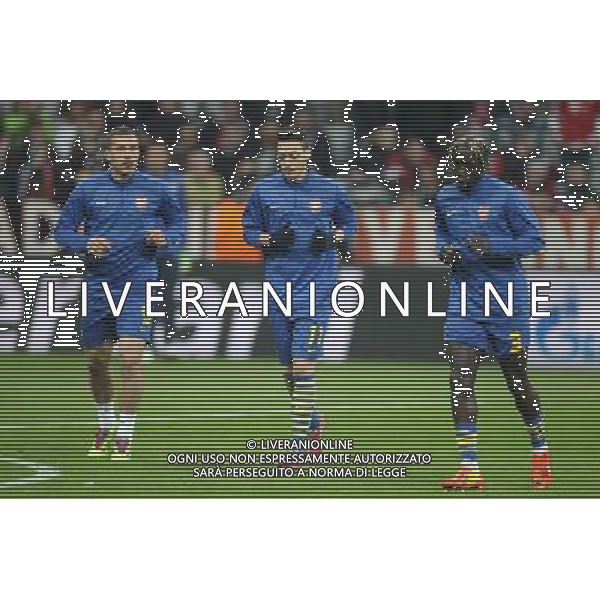 l-r: Lukas PODOLSKI #9 (FC Arsenal London), Mesut Oezil #11 (FC Arsenal London), Bacary SAGNA #3 (FC Arsenal London) beim warm up during the UEFA Champions League Round of 16, 2nd Leg match between FC Bayern Munich and Arsenal FC at the Allianz Arena in Muenchen, Germany on 2014/03/11. EXPA Pictures © 2014, PhotoCredit: EXPA/ Eibner-Pressefoto/ Kolbert *****ATTENTION - OUT of GER***** ©photoshot/AGENZIA ALDO LIVERANI SAS - ITALY ONLY - Bayern Monaco vs Arsenal UEFA Champions League Ottavi di 16 all\'Allianz Arena di Monaco di Baviera, in Germania 11 marzo 2014