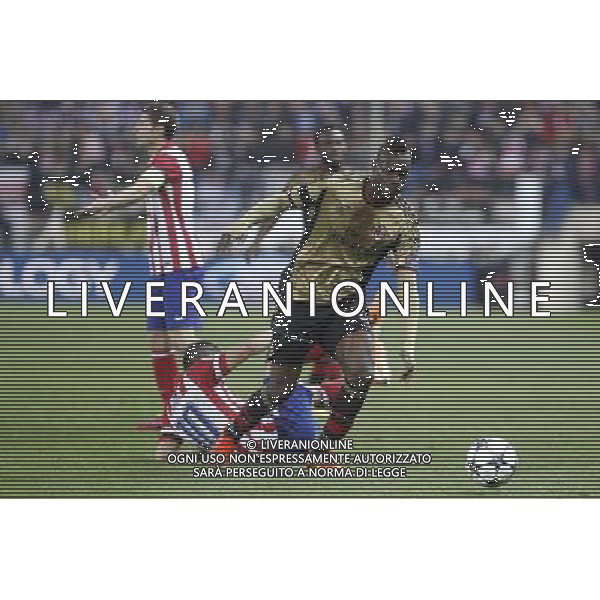 11.03.2014, Estadio Vicente Calderon, Madrid, ESP, UEFA CL, Atletico Madrid vs AC Milan, Achtelfinale, Rueckspiel, im Bild Atletico de MadridÇs Arda Turan (R) and Gabi and MilanÇs Balotelli // Atletico de MadridÇs Arda Turan (R) and Gabi and MilanÇs Balotelli during the UEFA Champions League Round of 16, 2nd Leg match between Club Atletico de Madrid and AC Milan at the Estadio Vicente Calderon in Madrid, Spain on 2014/03/12. EXPA Pictures © 2014, PhotoCredit: EXPA/ Alterphotos/ Victor Blanco *****ATTENTION - OUT of ESP, SUI***** ©PHOTOSHOT/AGENZIA ALDO LIVERANI SAS - ITALY ONLY - EDITORIAL USE ONLY ©PHOTOSHOT/AGENZIA ALDO LIVERANI SAS - ITALY ONLY - EDITORIAL USE ONLY