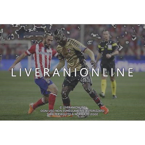 11.03.2014, Estadio Vicente Calderon, Madrid, ESP, UEFA CL, Atletico Madrid vs AC Milan, Achtelfinale, Rueckspiel, im Bild Atletico de MadridÇs Arda Turan (L) and MilanÇs Balotelli // Atletico de MadridÇs Arda Turan (L) and MilanÇs Balotelli during the UEFA Champions League Round of 16, 2nd Leg match between Club Atletico de Madrid and AC Milan at the Estadio Vicente Calderon in Madrid, Spain on 2014/03/12. EXPA Pictures © 2014, PhotoCredit: EXPA/ Alterphotos/ Victor Blanco *****ATTENTION - OUT of ESP, SUI***** ©PHOTOSHOT/AGENZIA ALDO LIVERANI SAS - ITALY ONLY - EDITORIAL USE ONLY ©PHOTOSHOT/AGENZIA ALDO LIVERANI SAS - ITALY ONLY - EDITORIAL USE ONLY