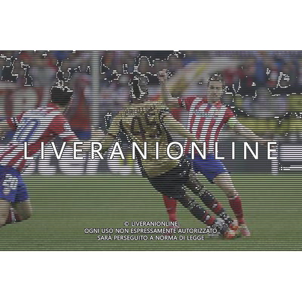 11.03.2014, Estadio Vicente Calderon, Madrid, ESP, UEFA CL, Atletico Madrid vs AC Milan, Achtelfinale, Rueckspiel, im Bild Atletico de MadridÇs Gabi (R) and MilanÇs Balotelli // Atletico de MadridÇs Gabi (R) and MilanÇs Balotelli during the UEFA Champions League Round of 16, 2nd Leg match between Club Atletico de Madrid and AC Milan at the Estadio Vicente Calderon in Madrid, Spain on 2014/03/12. EXPA Pictures © 2014, PhotoCredit: EXPA/ Alterphotos/ Victor Blanco *****ATTENTION - OUT of ESP, SUI***** ©PHOTOSHOT/AGENZIA ALDO LIVERANI SAS - ITALY ONLY - EDITORIAL USE ONLY ©PHOTOSHOT/AGENZIA ALDO LIVERANI SAS - ITALY ONLY - EDITORIAL USE ONLY