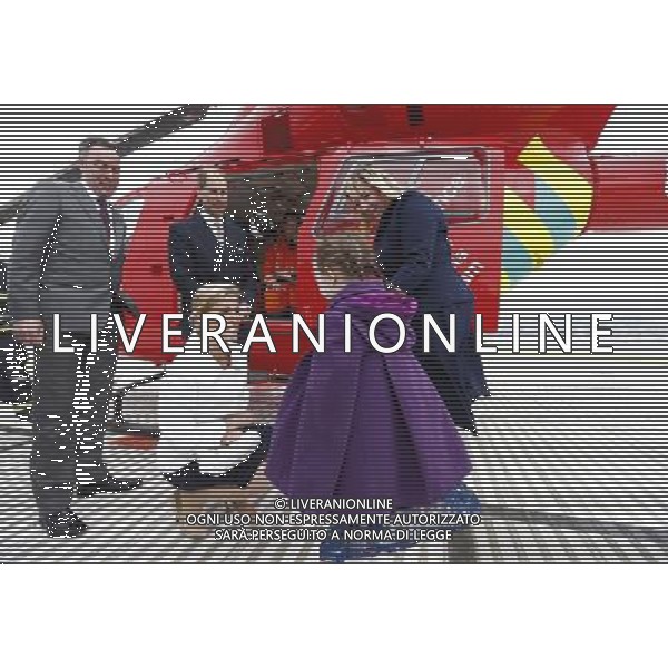 Britain\'s Prince Edward stands with the chief executive of London\'s Air Ambulance Graham Hodgkin (L) as his wife Sophie, Countess of Wessex speaks to Iris Filbee, 7, and her mother Sarah at the Royal Hospital in east London March 10, 2014. Prince Edward celebrated his 50th birthday on Monday by visiting the headquarters of London\'s Air Ambulance. Iris was treated by doctors and paramedics from the London Air Ambulance after an accident. ©PHOTOSHOT/AGENZIA ALDO LIVERANI SAS - ITALY ONLY - REALI INGLESI: Il principe Edward esua moglie Sophie, contessa di Wessex presso il Royal Hospital nella zona est di Londra
