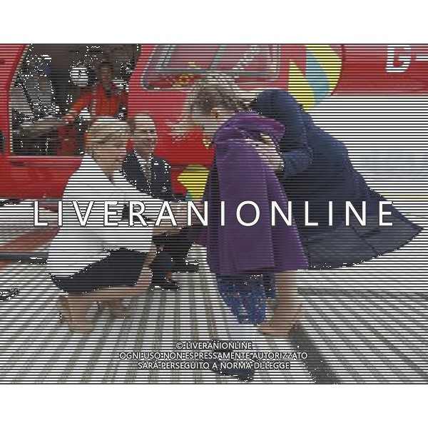 Britain\'s Prince Edward, his wife Sophie, Countess of Wessex crouch as they speak to Iris Filbee, 7, and her mother Sarah at the Royal Hospital in east London March 10, 2014. Prince Edward celebrated his 50th birthday on Monday by visiting the headquarters of London\'s Air Ambulance. Iris was treated by doctors and paramedics from the London Air Ambulance after an accident. ©PHOTOSHOT/AGENZIA ALDO LIVERANI SAS - ITALY ONLY - REALI INGLESI: Il principe Edward esua moglie Sophie, contessa di Wessex presso il Royal Hospital nella zona est di Londra