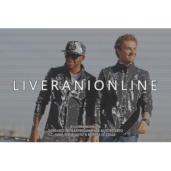 (L to R): Lewis Hamilton (GBR) Mercedes AMG F1 and team mate Nico Rosberg (GER) Mercedes AMG F1 W05 on the beach. 13.03.2014. Formula 1 World Championship, Rd 1, Australian Grand Prix, Albert Park, Melbourne, Australia, Preparation Day. - www.xpbimages.com, EMail: requests@xpbimages.com - copy of publication required for printed pictures. Every used picture is fee-liable. © Copyright: Moy / XPB Images AG ALDO LIVERANI SAS ONLY ITALY
