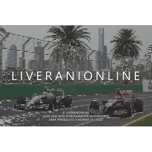 (L to R): Jenson Button (GBR) McLaren MP4-29 and Daniil Kvyat (RUS) Scuderia Toro Rosso STR9. 15.03.2014. Formula 1 World Championship, Rd 1, Australian Grand Prix, Albert Park, Melbourne, Australia, Qualifying Day. - www.xpbimages.com, EMail: requests@xpbimages.com - copy of publication required for printed pictures. Every used picture is fee-liable. © Copyright: Photo4 / XPB Images AG ALDO LIVERANI SAS ONLY ITALY