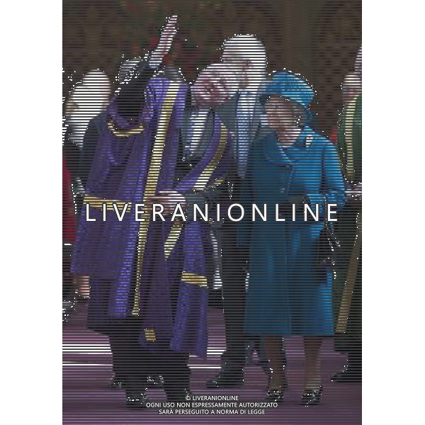 Her Majesty The Queen, accompanied by His Royal Highness The Duke of Edinburgh, visited Royal Holloway, University of London. The visit will celebrate the Diamond Jubilee Regius Professorship of Music, awarded by Her Majesty in 2013. The Queen and The Duke attended a performance of music in the in the Chapel, before meeting students and staff in the Picture Gallery. The Queen unveiled a plaque, marking the visit and Regius Professorship. THE PRINCIPAL PROF PAUL LAYZELL SHOWS SOME OF THE ART WORK THE ©photoshot/AGENZIA ALDO LIVERANI SAS - ITALY ONLY - REALI INGLESI: la Regina Elisabetta II, in visita alla Royal Holloway, University di Londra