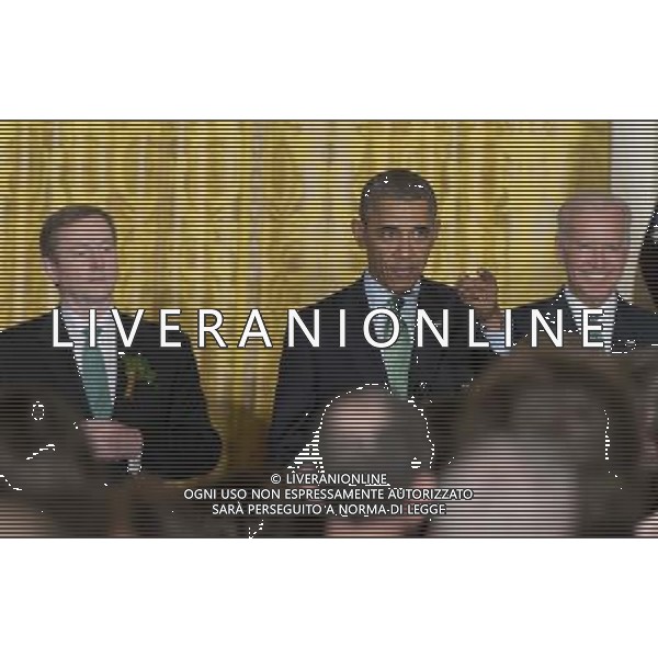 United States President Barack Obama hosts a St. Patrick\'s Day reception attended by Prime Minister Enda Kenny of Ireland in the East Room of the White House in Washington, D.C., USA, 14 March 2014. From left to right: Prime Minister Enda Kenny of Ireland, President Obama, and U.S. Vice President Joe Biden. AG ALDO LIVERANI SAS ONLY ITALY