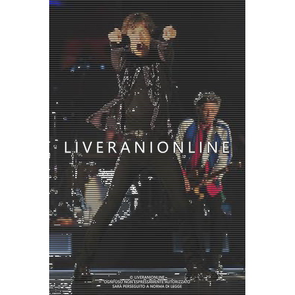 (140315) -- SINGAPORE, March 15, 2014 () -- The lead singer of British rock band The Rolling Stones Mick Jagger performs with his band at Singapore\'s Marina Bay Sands Expo and Convention Centre, March 15, 2014. The Rolling Stones held a sole concert in Singapore on Saturday. (/Then Chih Wey)(zjl) AG ALDO LIVERANI SAS ONLY ITALY