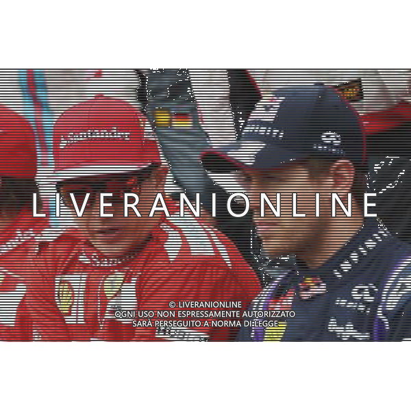 (L to R): Kimi Raikkonen (FIN) Ferrari with Sebastian Vettel (GER) Red Bull Racing at the drivers start of season photograph. 16.03.2014. Formula 1 World Championship, Rd 1, Australian Grand Prix, Albert Park, Melbourne, Australia, Race Day. - www.xpbimages.com, EMail: requests@xpbimages.com - copy of publication required for printed pictures. Every used picture is fee-liable. © Copyright: Batchelor / XPB Images AG ALDO LIVERANI SAS ONLY ITALY