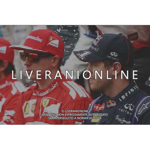 (L to R): Kimi Raikkonen (FIN) Ferrari with Sebastian Vettel (GER) Red Bull Racing at the drivers start of season photograph. 16.03.2014. Formula 1 World Championship, Rd 1, Australian Grand Prix, Albert Park, Melbourne, Australia, Race Day. - www.xpbimages.com, EMail: requests@xpbimages.com - copy of publication required for printed pictures. Every used picture is fee-liable. © Copyright: Batchelor / XPB Images AG ALDO LIVERANI SAS ONLY ITALY