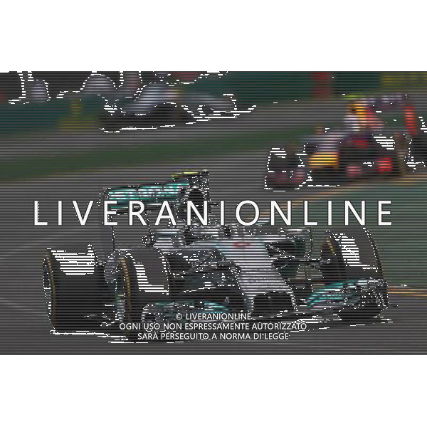 Nico Rosberg (GER) Mercedes AMG F1 W05 leads Daniel Ricciardo (AUS) Red Bull Racing RB10. 16.03.2014. Formula 1 World Championship, Rd 1, Australian Grand Prix, Albert Park, Melbourne, Australia, Race Day. - www.xpbimages.com, EMail: requests@xpbimages.com - copy of publication required for printed pictures. Every used picture is fee-liable. © Copyright: Batchelor / XPB Images AG ALDO LIVERANI SAS ONLY ITALY