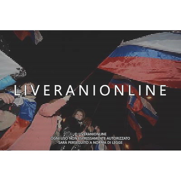 (140316) -- SIMFEROPOL, March 16, 2014 () -- Crimeans holding russian flags celebrate in front of the parliament building in Simferopol, capital of Ukraine\'s Autonomous Republic of Crimea, March 16, 2014. Although the 2014 Crimea referendum was still in process and results might take hours of processing before coming out, Crimeans in the capital city of the peninsula were already seen streaming toward the central city square for celebration. Local television quoted late Sunday an exit poll by the Crimean Republic Institute for Political and Social Studies as saying that 93 percent of voters in the Autonomous Republic of Crimea were in favor of reunification with Russia. (/Sadat) AG ALDO LIVERANI SAS ONLY ITALY