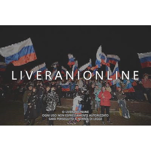 (140316) -- SIMFEROPOL, March 16, 2014 () -- Crimeans holding russian flags celebrate in front of the parliament building in Simferopol, capital of Ukraine\'s Autonomous Republic of Crimea, March 16, 2014. Although the 2014 Crimea referendum was still in process and results might take hours of processing before coming out, Crimeans in the capital city of the peninsula were already seen streaming toward the central city square for celebration. Local television quoted late Sunday an exit poll by the Crimean Republic Institute for Political and Social Studies as saying that 93 percent of voters in the Autonomous Republic of Crimea were in favor of reunification with Russia. (/Sadat) AG ALDO LIVERANI SAS ONLY ITALY