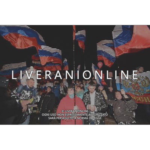 (140316) -- SIMFEROPOL, March 16, 2014 () -- Crimeans holding russian flags celebrate in front of the parliament building in Simferopol, capital of Ukraine\'s Autonomous Republic of Crimea, March 16, 2014. Although the 2014 Crimea referendum was still in process and results might take hours of processing before coming out, Crimeans in the capital city of the peninsula were already seen streaming toward the central city square for celebration. Local television quoted late Sunday an exit poll by the Crimean Republic Institute for Political and Social Studies as saying that 93 percent of voters in the Autonomous Republic of Crimea were in favor of reunification with Russia. (/Sadat) AG ALDO LIVERANI SAS ONLY ITALY