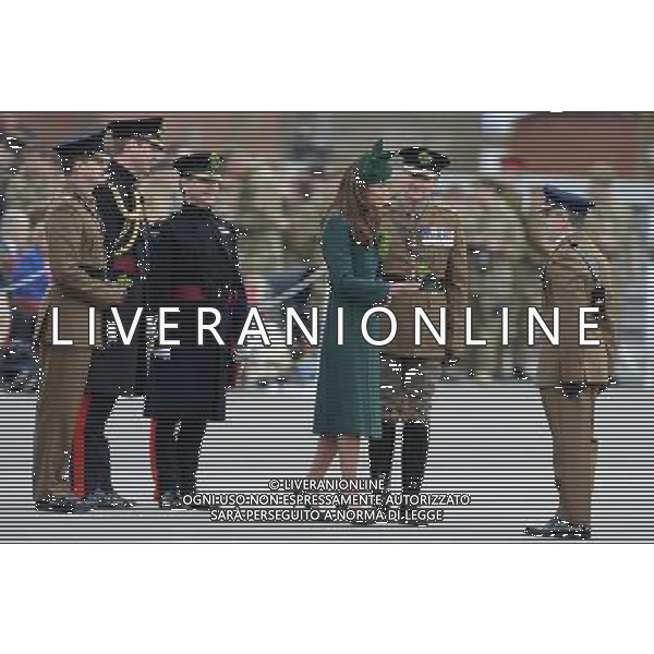 The Duke and Duchess of Cambridge visit the 1st Battalion Irish Guards at the St. Patrick\'s Day Parade at Mons Barracks, Aldershot, Hampshire.The Duke of Cambridge attended the Parade as Colonel of the Regiment. The Duchess of Cambridge presented the traditional sprigs of shamrocks to the Officers and Guardsmen of the Regiment. 17.3.14 ©PHOTOSHOT/AGENZIA ALDO LIVERANI SAS - ITALY ONLY - REALI INGLESI: Il Principe William e Kate Middleton Duchessa di Cambridge visitano il 1mo Battaglione delle Guardie Irlandesi presso il St. Patricks Day Parade a Mons Barracks Aldershot 17 Marzo, 2014