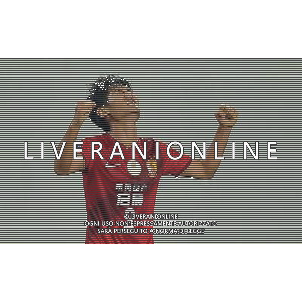 (140318) -- GUANGZHOU, March 18, 2014 () -- Liao Lisheng of Guangzhou Evergrande of China, celebrates after scoring during the group G match of 2014 AFC Champions League against Jeonbuk Hyundai Motors of South Korea in Guangzhou, capital of south China\'s Guangdong Province, March 18, 2014. Guangzhou Evergrande won 3-1. (/Liu Dawei) AG ALDO LIVERANI SAS ONLY ITALY