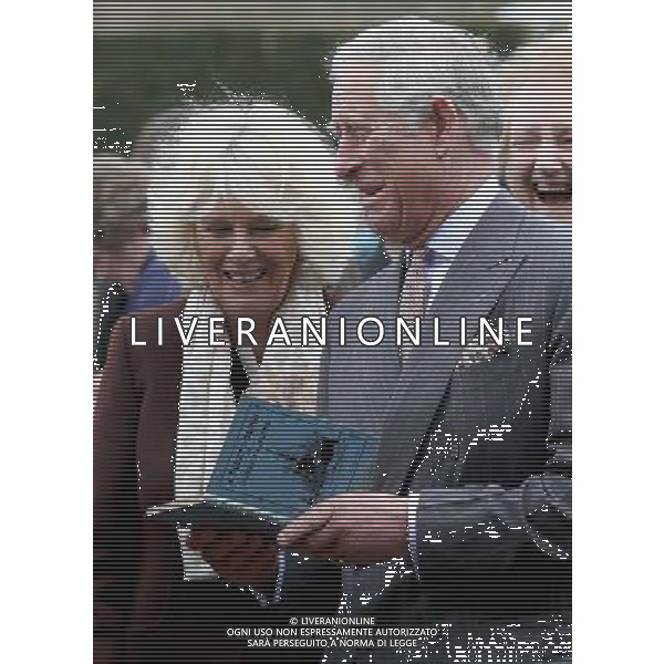 BURWASH, UNITED KINGDOM - MARCH 19: Prince Charles, Prince of Wales and Camilla, Duchess of Cornwall look at a copy of \'A Fleet in Being\' by Rudyard Kipling they were presented with as they visit Bateman\'s, the East Sussex home of the author, on March 19, 2014 in Burwash, United Kingdom. Bateman\'s was the secluded family home of the author, who wrote \'Jungle Book\' and \'If\'. AG ALDO LIVERANI SAS ONLY ITALY
