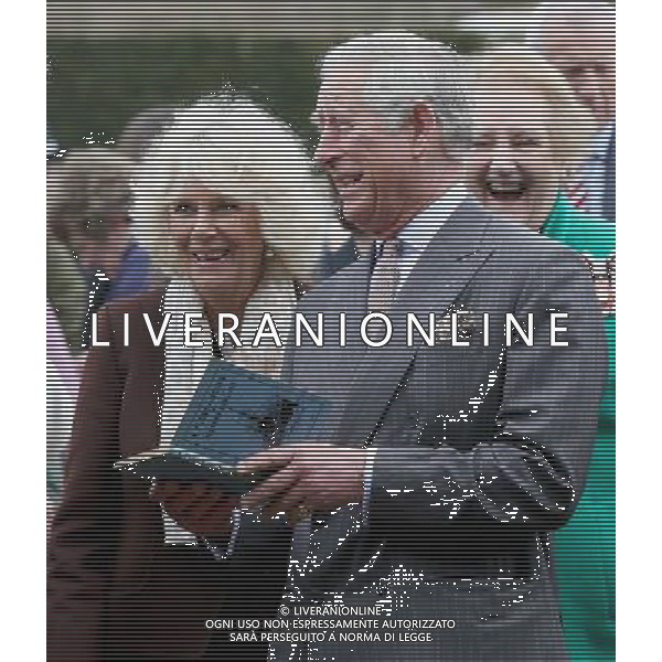 BURWASH, UNITED KINGDOM - MARCH 19: Prince Charles, Prince of Wales and Camilla, Duchess of Cornwall look at a copy of \'A Fleet in Being\' by Rudyard Kipling they were presented with as they visit Bateman\'s, the East Sussex home of the author, on March 19, 2014 in Burwash, United Kingdom. Bateman\'s was the secluded family home of the author, who wrote \'Jungle Book\' and \'If\'. AG ALDO LIVERANI SAS ONLY ITALY