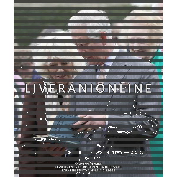 BURWASH, UNITED KINGDOM - MARCH 19: Prince Charles, Prince of Wales and Camilla, Duchess of Cornwall look at a copy of \'A Fleet in Being\' by Rudyard Kipling they were presented with as they visit Bateman\'s, the East Sussex home of the author, on March 19, 2014 in Burwash, United Kingdom. Bateman\'s was the secluded family home of the author, who wrote \'Jungle Book\' and \'If\'. AG ALDO LIVERANI SAS ONLY ITALY