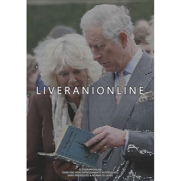 BURWASH, UNITED KINGDOM - MARCH 19: Prince Charles, Prince of Wales and Camilla, Duchess of Cornwall look at a copy of \'A Fleet in Being\' by Rudyard Kipling they were presented with as they visit Bateman\'s, the East Sussex home of the author, on March 19, 2014 in Burwash, United Kingdom. Bateman\'s was the secluded family home of the author, who wrote \'Jungle Book\' and \'If\'. AG ALDO LIVERANI SAS ONLY ITALY
