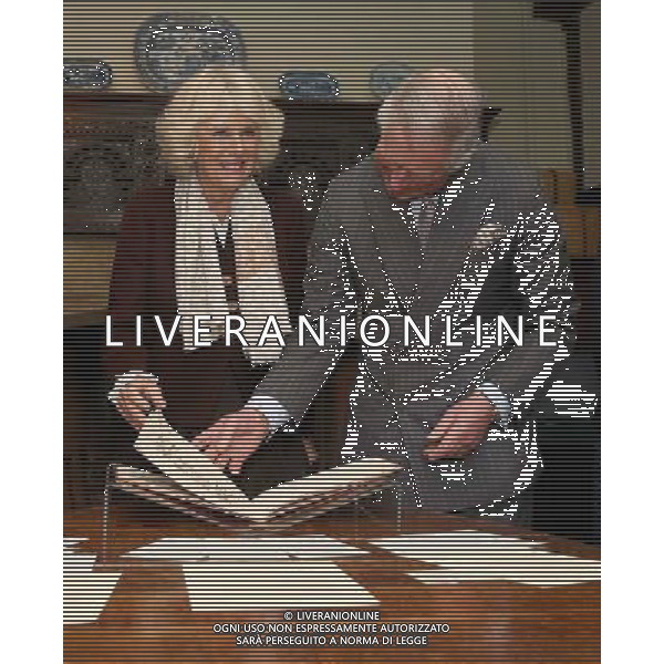 BURWASH, UNITED KINGDOM - MARCH 19: Prince Charles, Prince of Wales and Camilla, Duchess of Cornwall look at manuscripts as they visit Bateman\'s, the East Sussex home of the author, on March 19, 2014 in Burwash, United Kingdom. Bateman\'s was the secluded family home of the author who wrote the \'Jungle Book\' and \'If\'. AG ALDO LIVERANI SAS ONLY ITALY