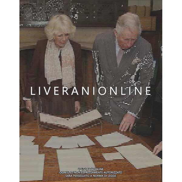 BURWASH, UNITED KINGDOM - MARCH 19: Prince Charles, Prince of Wales and Camilla, Duchess of Cornwall look at manuscripts as they visit Bateman\'s, the East Sussex home who wrote the author, on March 19, 2014 in Burwash, United Kingdom. Bateman\'s was the secluded family home who wrote the author who wrote the \'Jungle Book\' and \'If\'. AG ALDO LIVERANI SAS ONLY ITALY
