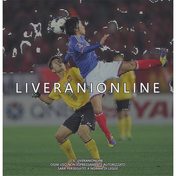 (140312) -- YOKOHAMA, March 12, 2014 () -- Huang Bowen (L) of Guangzhou Evergrande competes during the AFC Champions League 2014 Group G football match against Yokohama F.Marinos in Yokohama, Japan on March 12, 2014. The match ended in 1-1 draw. (/Liu Dawei) (hy) ©photohsot/AGENZIA ALDO LIVERANI SAS - ITALY ONLY - Guangzhou Evergrande Vs Yokohama F Marinos partita AFC Champions League a Yokohama, Giappone, 12 marzo, 2014.