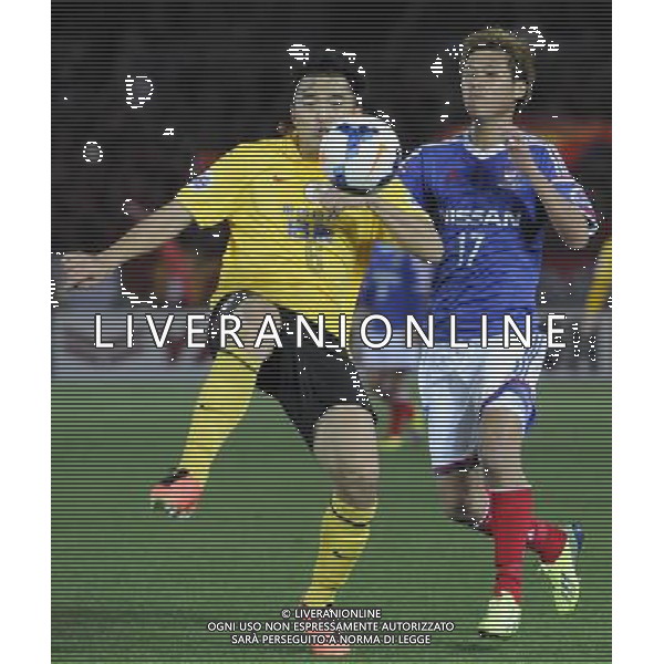 (140312) -- YOKOHAMA, March 12, 2014 () -- Feng Xiaoting (L) of Guangzhou Evergrande competes for the ball during the AFC Champions League match againt Yokohama F Marinos in Yokohama, Japan, March 12, 2014. The match ended in 1-1 draw.(/Stringer) ©photohsot/AGENZIA ALDO LIVERANI SAS - ITALY ONLY - Guangzhou Evergrande Vs Yokohama F Marinos partita AFC Champions League a Yokohama, Giappone, 12 marzo, 2014.