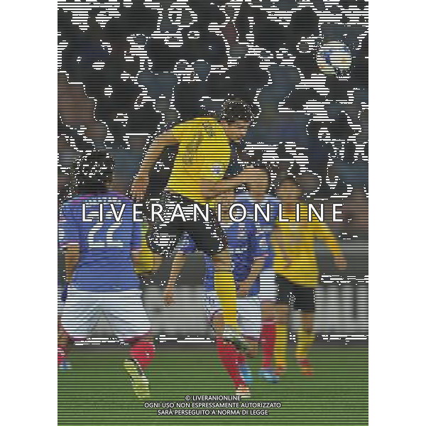 (140312) -- YOKOHAMA, March 12, 2014 () -- Elikeson (Above) of Guangzhou Evergrande heads for the ball during the AFC Champions League match between Guangzhou Evergrande and Yokohama F Marinos in Yokohama, Japan, March 12, 2014. The match ended in 1-1 draw. (/Liu Dawei) (hy) ©photohsot/AGENZIA ALDO LIVERANI SAS - ITALY ONLY - Guangzhou Evergrande Vs Yokohama F Marinos partita AFC Champions League a Yokohama, Giappone, 12 marzo, 2014.