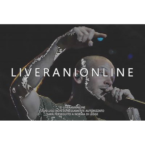 (140323) -- MONTEVIDEO, March 23, 2014 (Xinhua) -- Rene Perez, known as \'Residente\' and singer of the Puerto Rican band \'Calle 13\', performs during a concert to present its new album titled \'Multiviral\', at the Municipal Velodrome in Montevideo, capital of Uruguay, on March 23, 2014. (Xinhua/Nicolas Celaya) (fnc) (ah) AG ALDO LIVERANI SAS ONLY ITALY