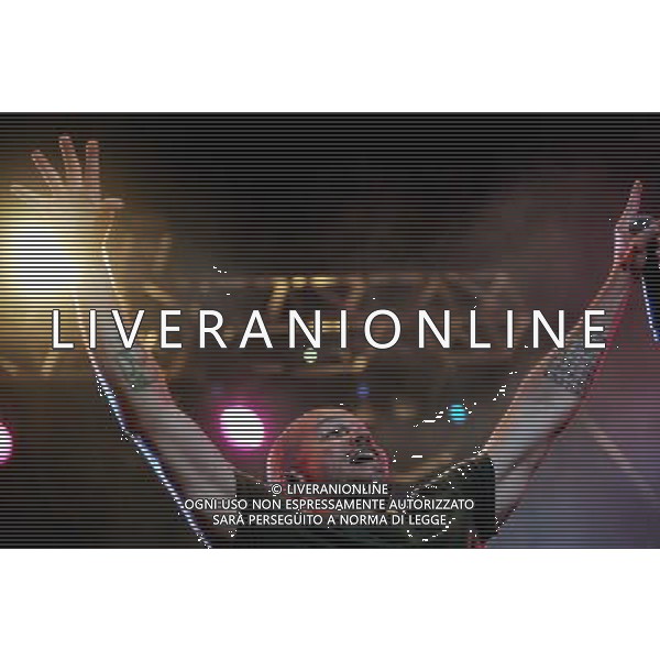(140323) -- MONTEVIDEO, March 23, 2014 (Xinhua) -- Rene Perez known as \'Residente\' and singer of the Puerto Rican band \'Calle 13\', performs during a concert to present its new album titled \'Multiviral\', at the Municipal Velodrome in Montevideo, capital of Uruguay, on March 23, 2014. (Xinhua/Nicolas Celaya) (fnc) (ah) AG ALDO LIVERANI SAS ONLY ITALY