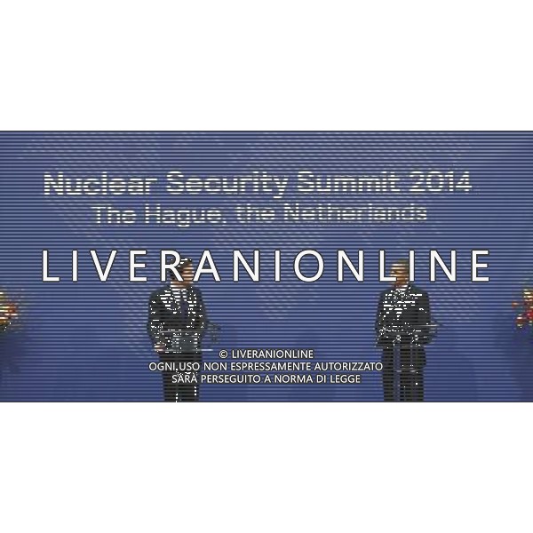 (140325) -- THE HAGUE, March 25, 2014 () -- Dutch Prime Minister Mark Rutte (L) and U.S. President Barack Obama attend the closing press conference of the Nuclear Security Summit (NSS) 2014 in The Hague, the Netherlands, on March 25, 2014. The Nuclear Security Summit (NSS) 2014 concluded in The Hague on Tuesday with a communique reached by world leaders to prevent nuclear material from falling into the hands of terrorists. (/Yin Gang) AG ALDO LIVERANI SAS ONLY ITALY