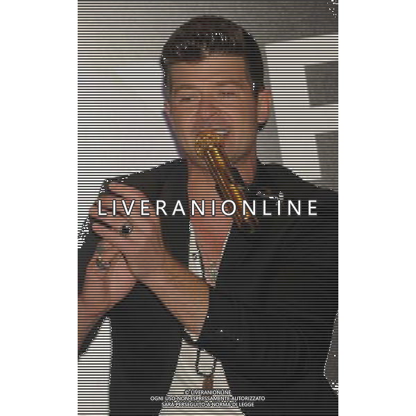 Singer Robin Thicke performs during the grand opening of EXPRESS Times Square on March 25, 2014 in New York City. AG ALDO LIVERANI SAS ONLY ITALY