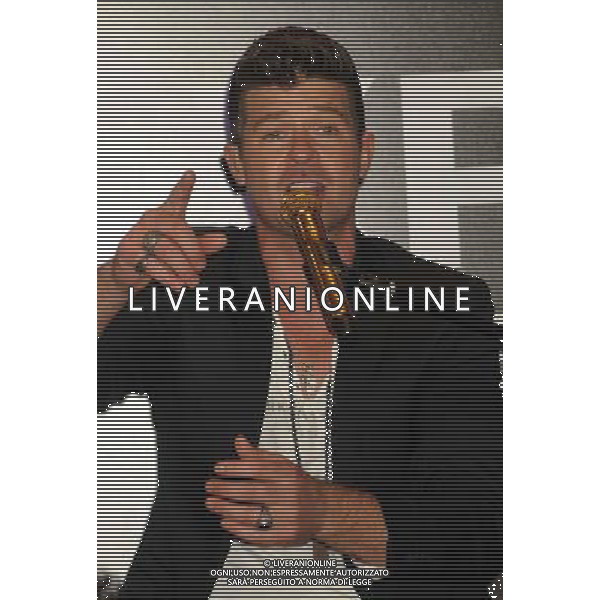 Singer Robin Thicke performs during the grand opening of EXPRESS Times Square on March 25, 2014 in New York City. AG ALDO LIVERANI SAS ONLY ITALY